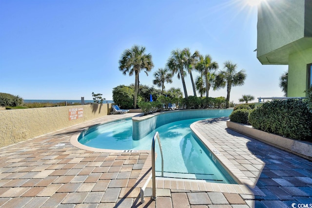 view of pool featuring a patio