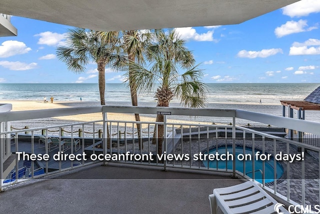 balcony with a view of the beach and a water view