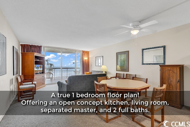 carpeted dining space featuring ceiling fan, a wall of windows, and a textured ceiling