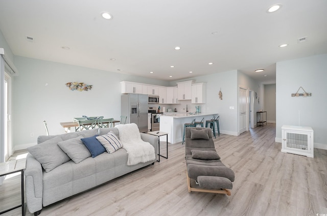 503 30th Ave N, Myrtle Beach, SC 29577 - living area with light wood-type flooring, recessed lighting, and baseboards
