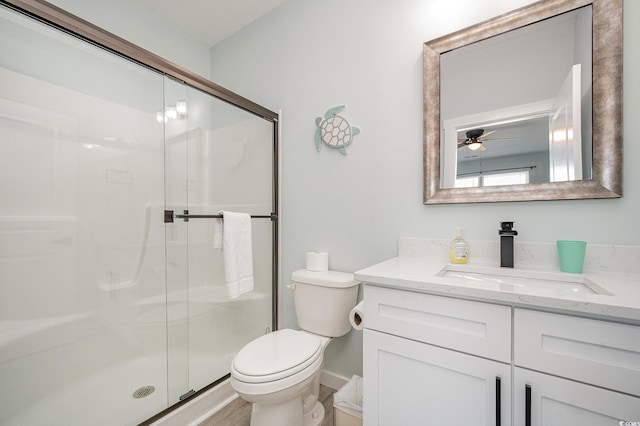 503 30th Ave N, Myrtle Beach, SC 29577 - bathroom featuring vanity, toilet, a stall shower, and ceiling fan