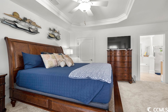 bedroom featuring crown molding, ensuite bath, tile flooring, a raised ceiling, and ceiling fan