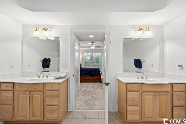 bathroom featuring ceiling fan, tile floors, and dual vanity