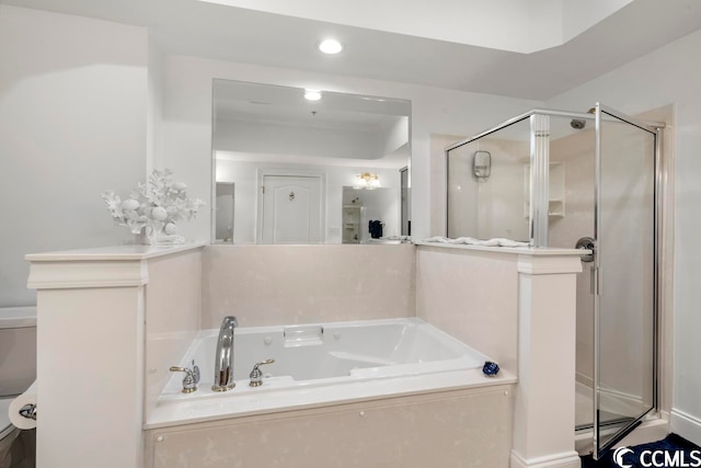 bathroom featuring independent shower and bath