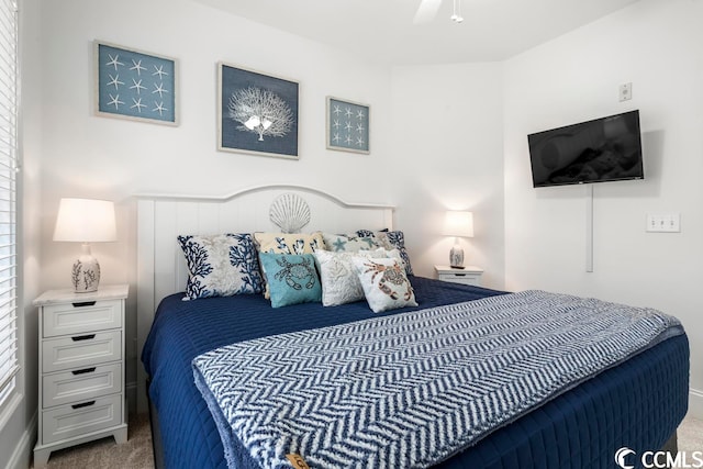 bedroom with ceiling fan and carpet flooring