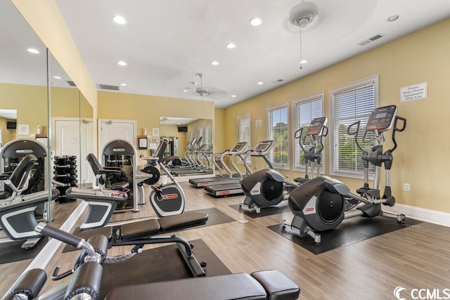 workout area with ceiling fan and hardwood / wood-style flooring