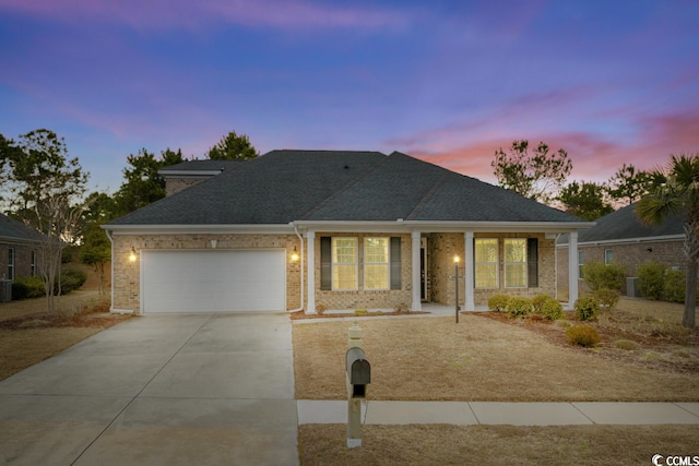 view of front of home with a garage