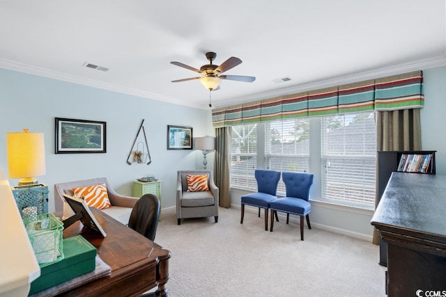 office space with light carpet, ceiling fan, and crown molding