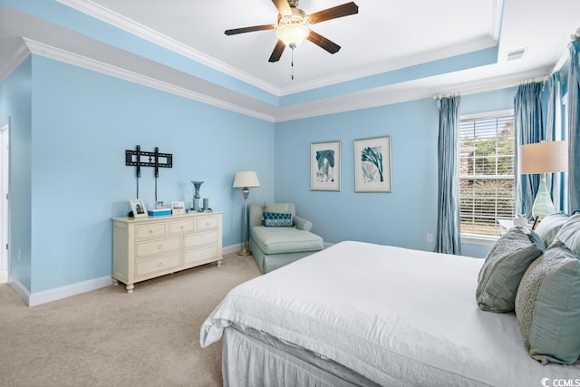 bedroom with light carpet, a raised ceiling, ceiling fan, and crown molding