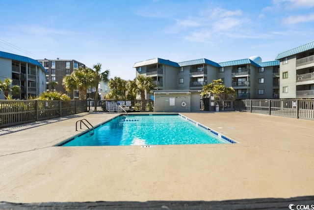 view of swimming pool featuring a patio area