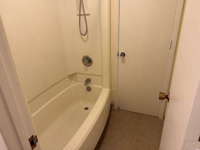 bathroom featuring tub / shower combination and tile patterned flooring
