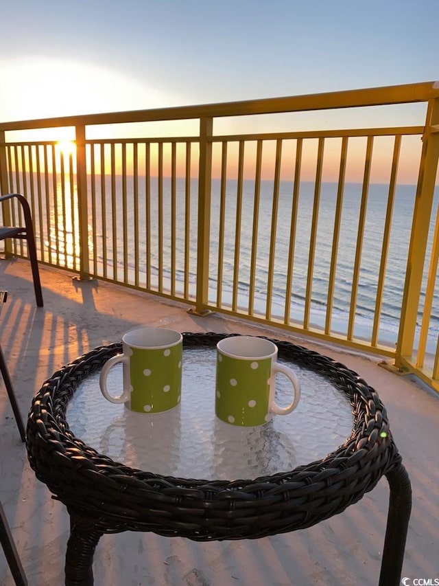 balcony featuring a water view