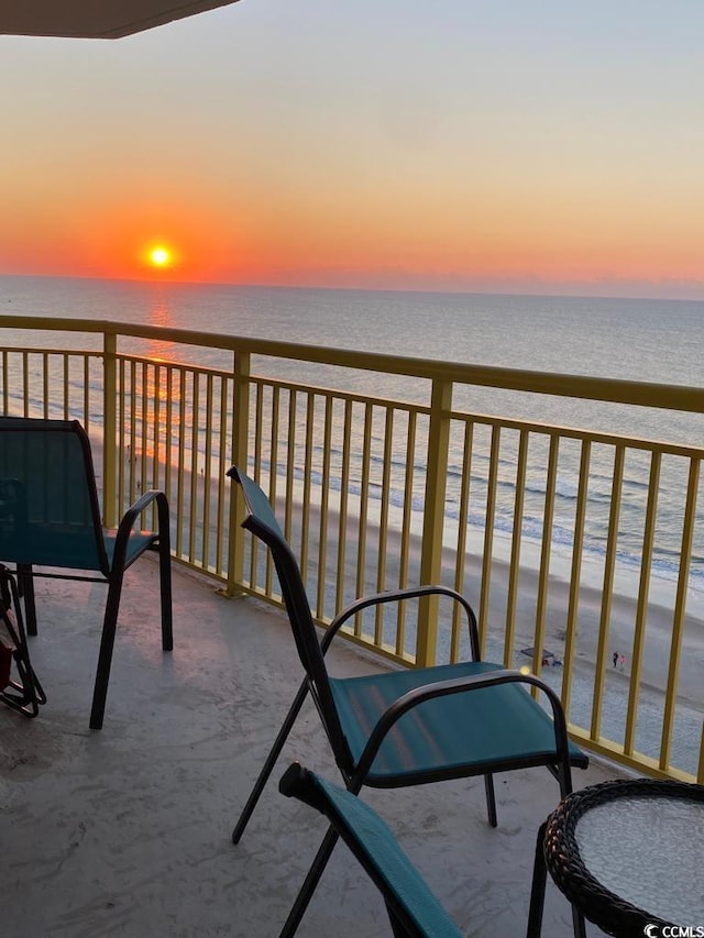 balcony at dusk with a water view