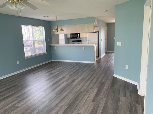 5020 Windsor Green Way Unit 103, Myrtle Beach, SC 29579 - kitchen with black microwave, freestanding refrigerator, dark wood finished floors, light brown cabinetry, and light countertops