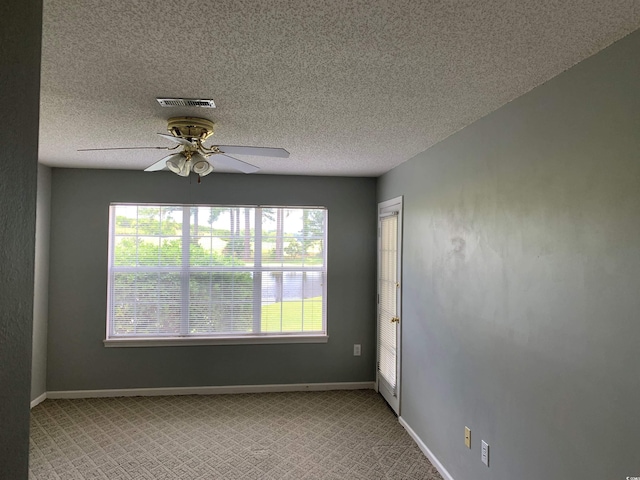 5020 Windsor Green Way Unit 103, Myrtle Beach, SC 29579 - carpeted spare room featuring a ceiling fan, healthy amount of natural light, and a textured ceiling