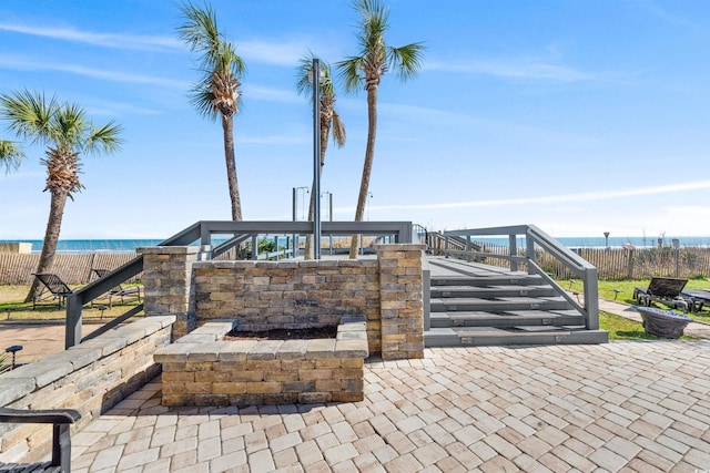 view of terrace with a water view