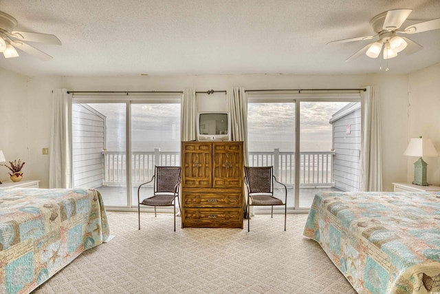 bedroom featuring ceiling fan, light carpet, and access to exterior