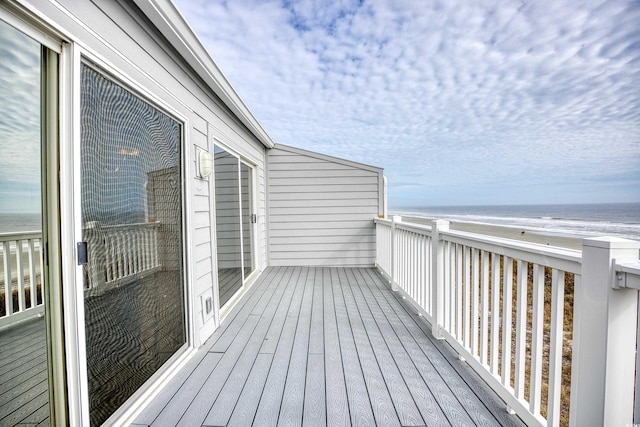 wooden terrace with a water view