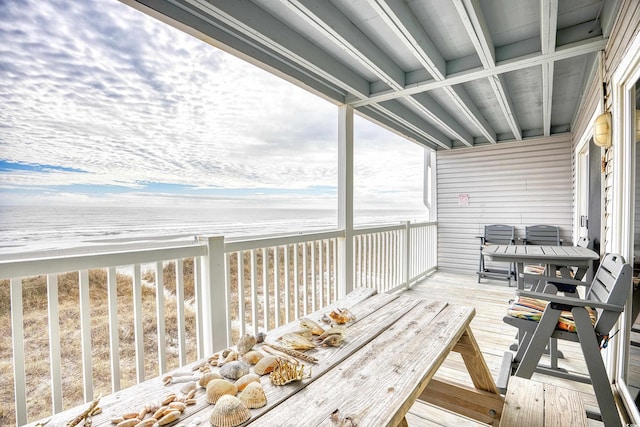 wooden terrace with a water view