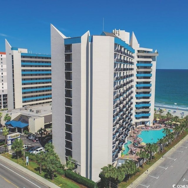 view of building exterior with a water view