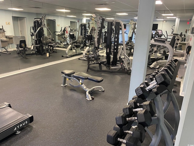 exercise room featuring a drop ceiling