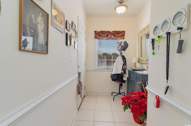 entryway with light tile flooring and ornamental molding