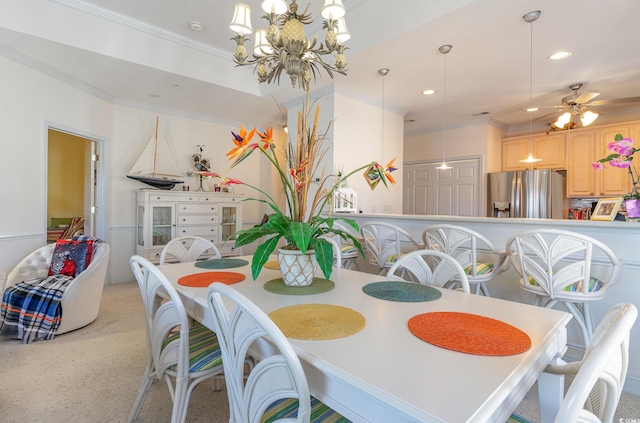 dining space featuring crown molding and ceiling fan with notable chandelier