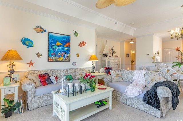 living room featuring ceiling fan with notable chandelier, ornamental molding, and light colored carpet