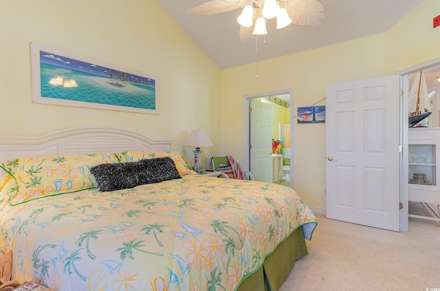 carpeted bedroom with lofted ceiling, ceiling fan, and ensuite bathroom