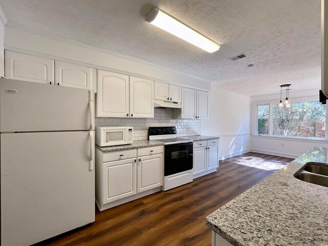 kitchen featuring decorative light fixtures, white appliances, white cabinets, light stone counters, and dark hardwood / wood-style flooring