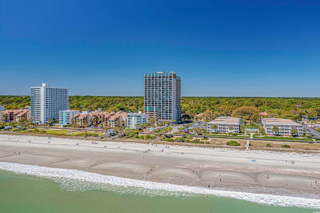 drone / aerial view with a beach view and a water view