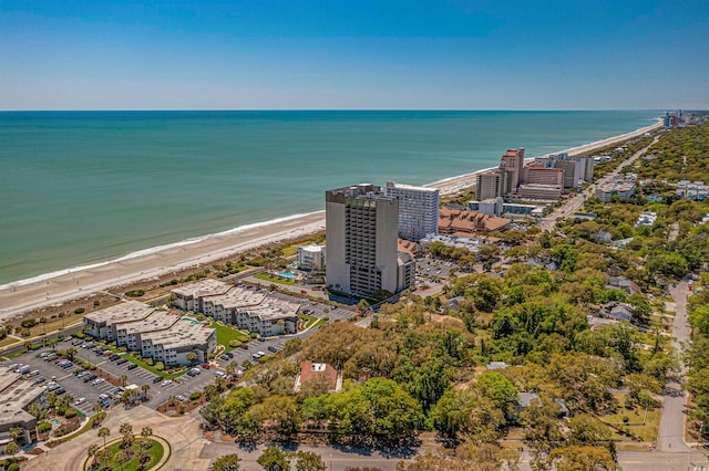 bird's eye view featuring a water view and a view of the beach