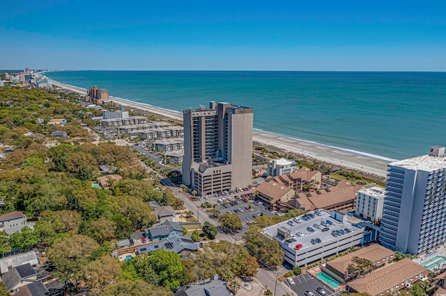 drone / aerial view with a water view and a beach view