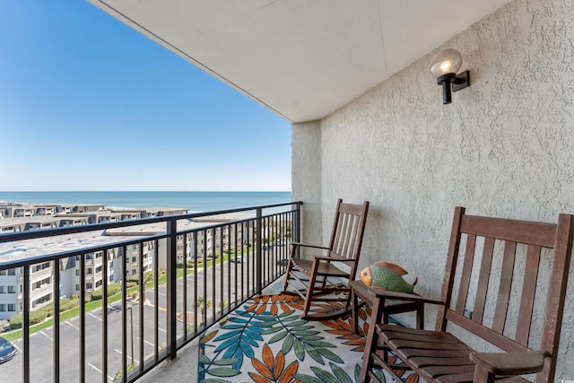 balcony featuring a water view