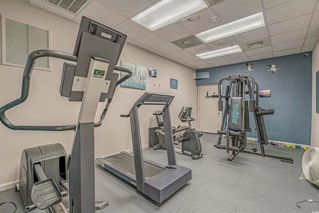 workout area featuring a paneled ceiling