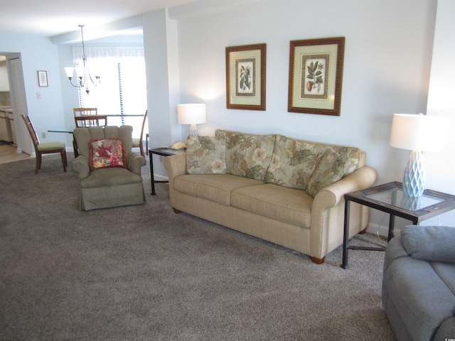 living room featuring a chandelier and carpet