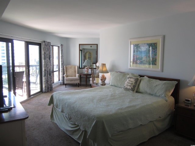 carpeted bedroom featuring access to exterior