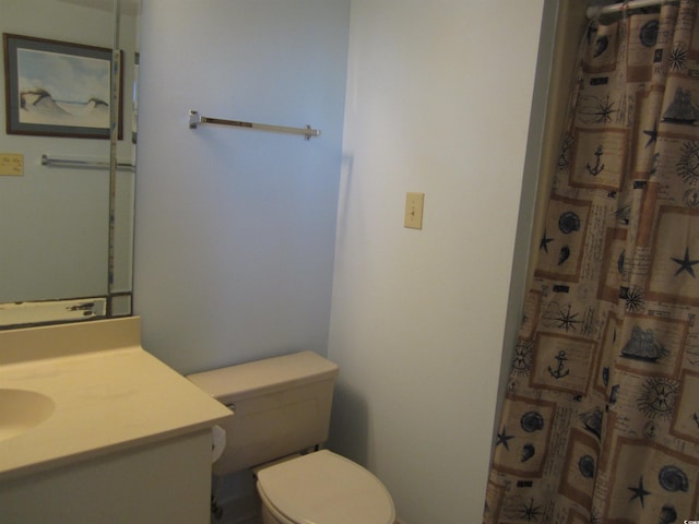 bathroom with toilet and vanity