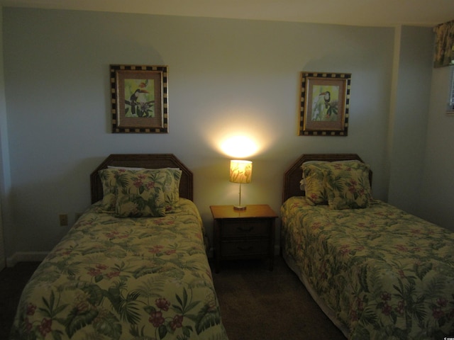 bedroom with dark carpet