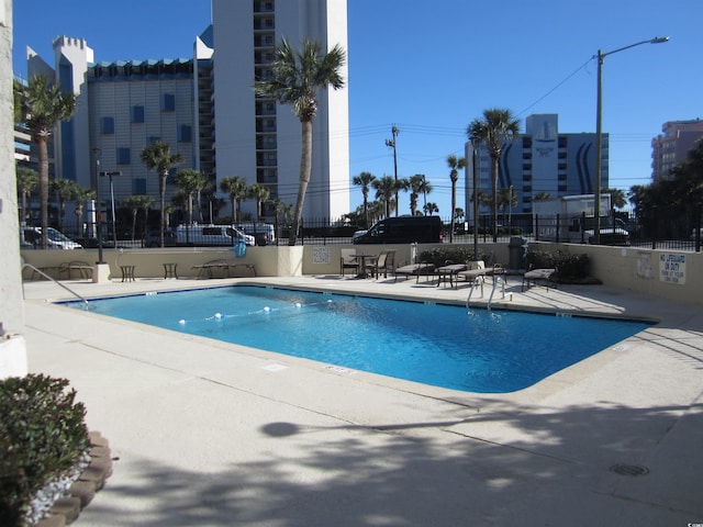 view of swimming pool featuring a patio