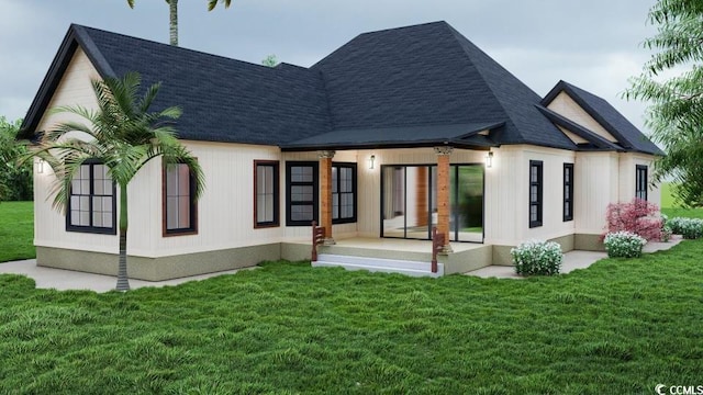 rear view of house with a lawn and roof with shingles