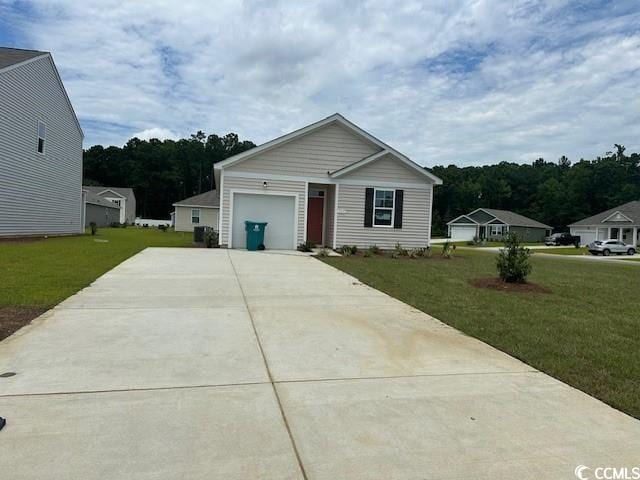 view of front facade featuring a garage and a front lawn