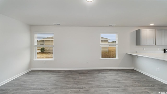 unfurnished dining area with light hardwood / wood-style floors