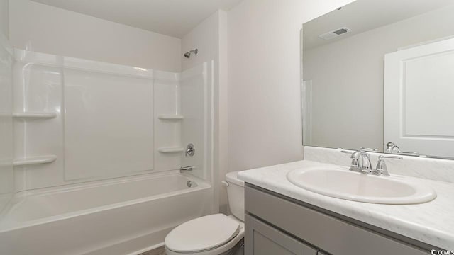 bathroom with vanity,  shower combination, toilet, and visible vents