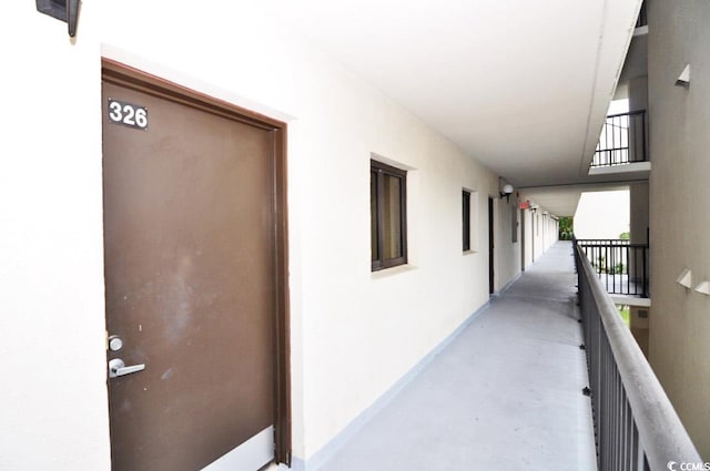 hall featuring concrete flooring