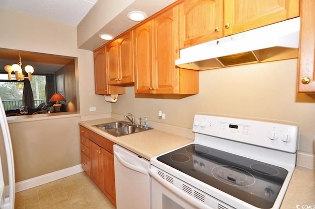 kitchen featuring white dishwasher, a chandelier, stove, sink, and light tile floors