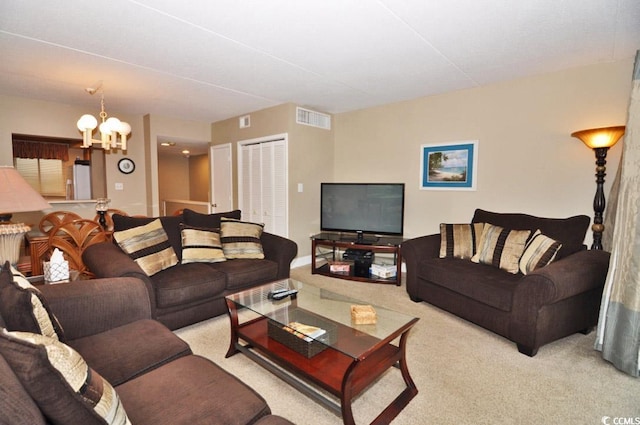 living room with carpet and a chandelier