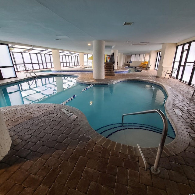 view of pool featuring an indoor hot tub