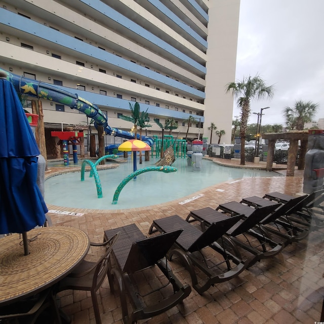 view of pool featuring a patio area