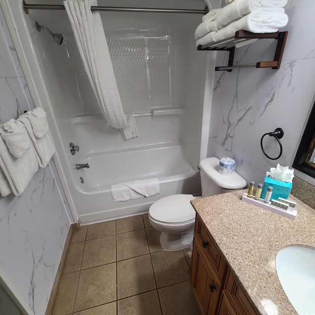 full bathroom featuring toilet, vanity, tile walls, tile floors, and shower / tub combo